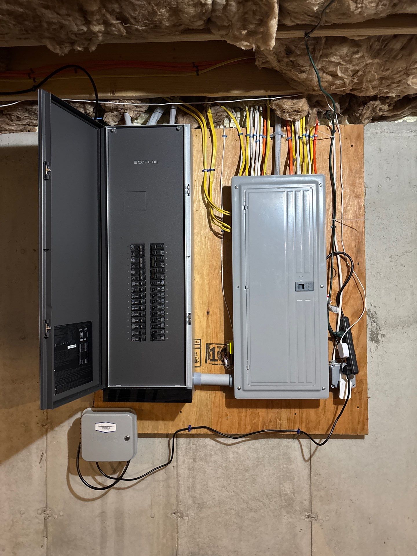 All Phase Electric LLC | EcoFlow Smart Home Panel on a plywood backboard beside an existing load centre | Nashua, NH